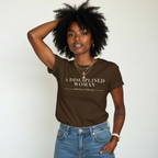 Woman wearing a brown t-shirt with 'A Disciplined Woman' text, standing against a plain background